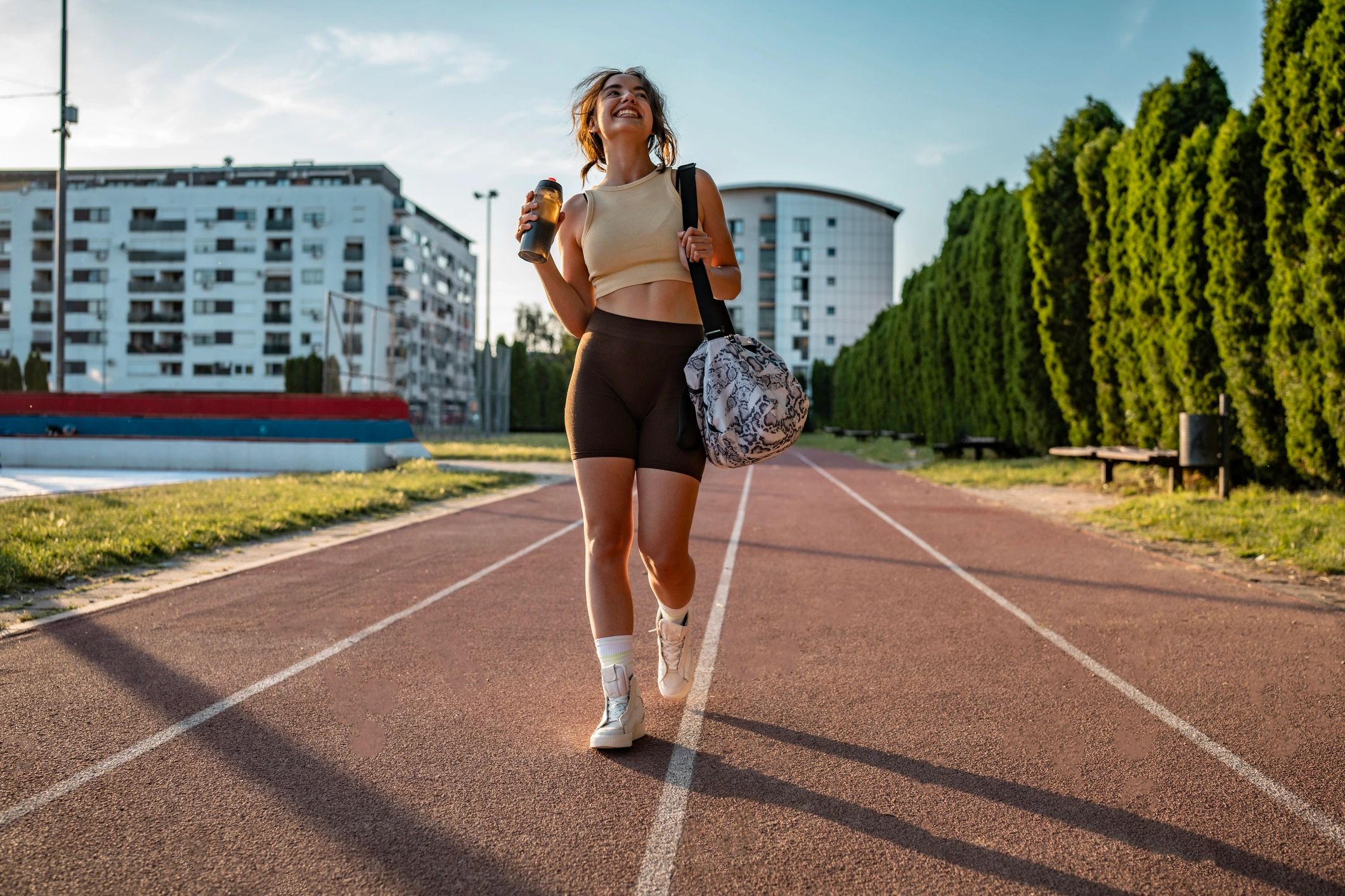Woman walking outdoors in stylish athletic shoes
